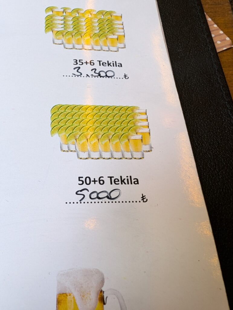 a menu depicting "50 + 6" tequila shots for 5000 TL